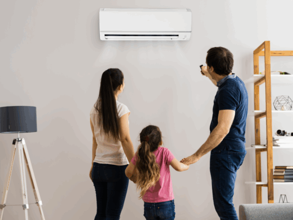 Family using a recently serviced wall-mounted split system air conditioner in their living room