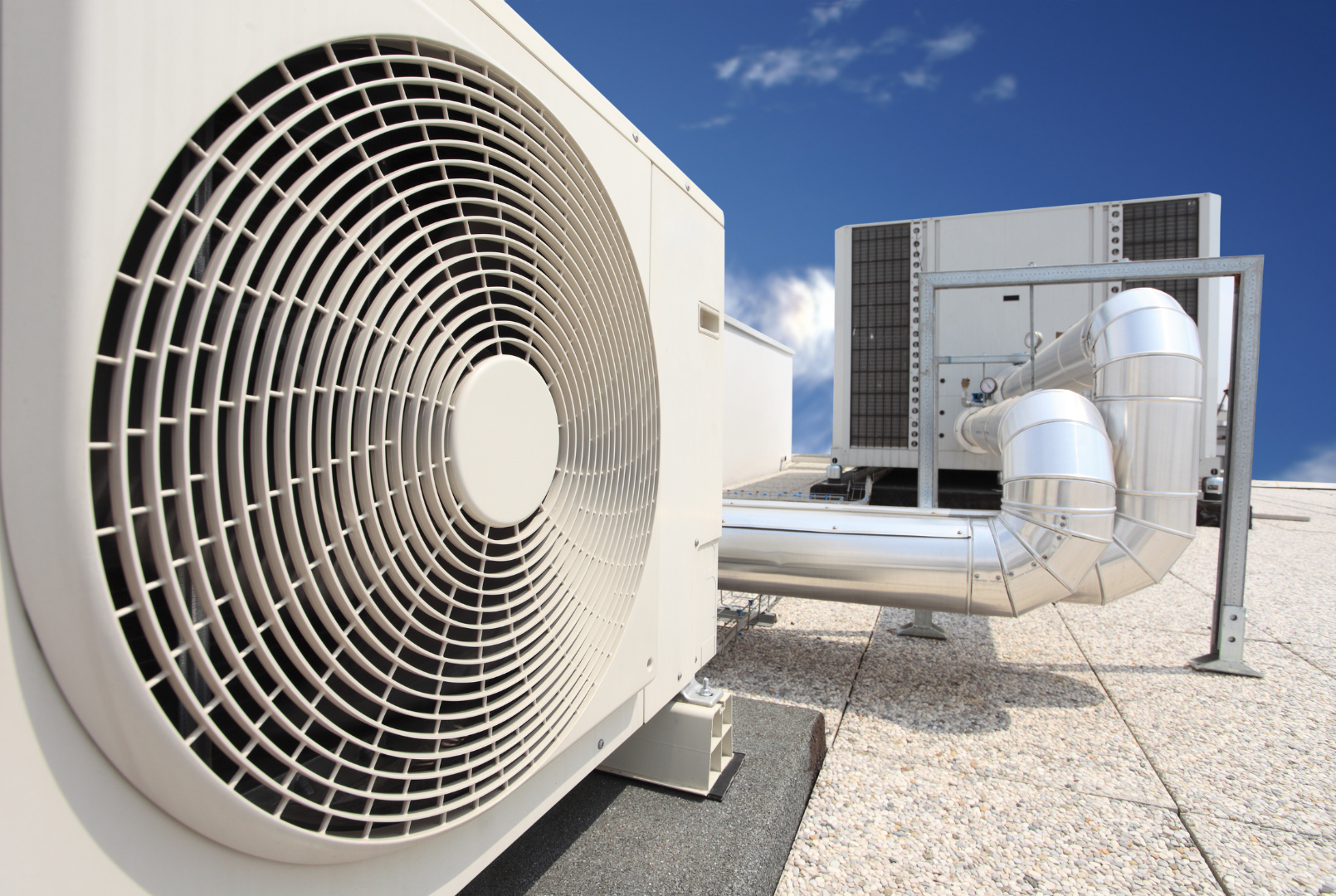Commercial air conditioning system, including ducted units, control systems, and rooftop installation