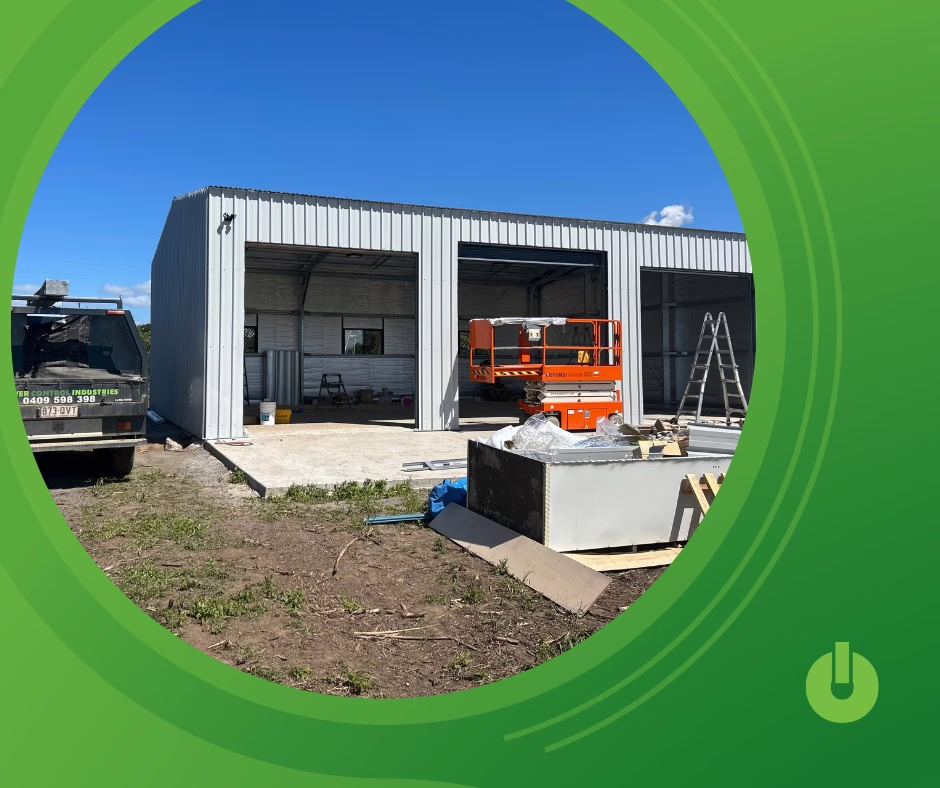 Electrical project site under construction with workshop framing, scissor lift and installation materials on location {{brizy_dc_image_alt imageSrc=