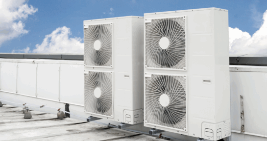 Rooftop-mounted commercial air conditioning condenser units used in large-scale HVAC systems