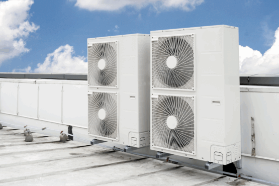 Rooftop-mounted commercial air conditioning condenser units used in large-scale HVAC systems