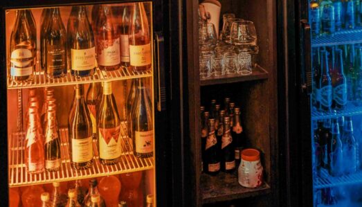 Under‑bar commercial drinks fridge filled with beverages inside a Brisbane hospitality venue